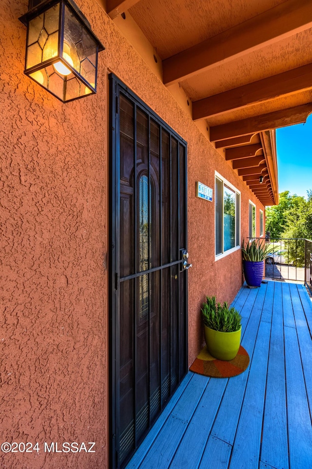 entrance to property featuring a balcony