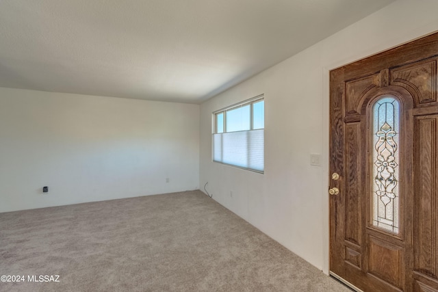 view of carpeted foyer