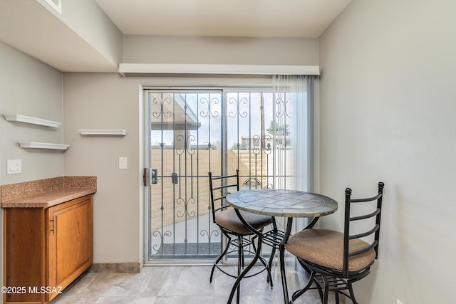 dining room with baseboards