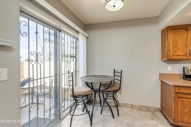 dining area featuring baseboards