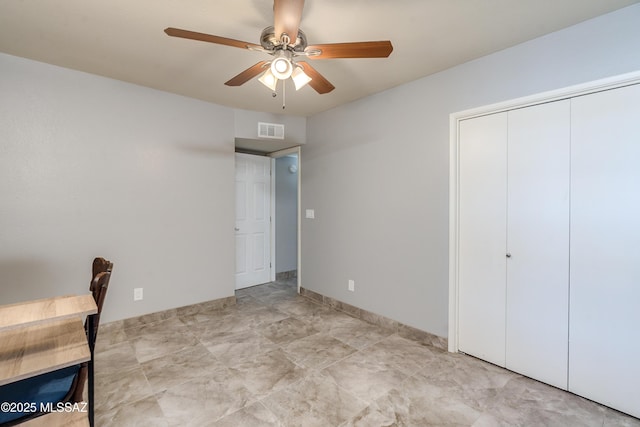 unfurnished bedroom featuring a ceiling fan, a closet, and visible vents