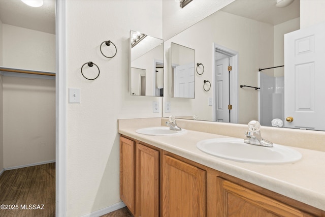 bathroom with vanity and hardwood / wood-style floors