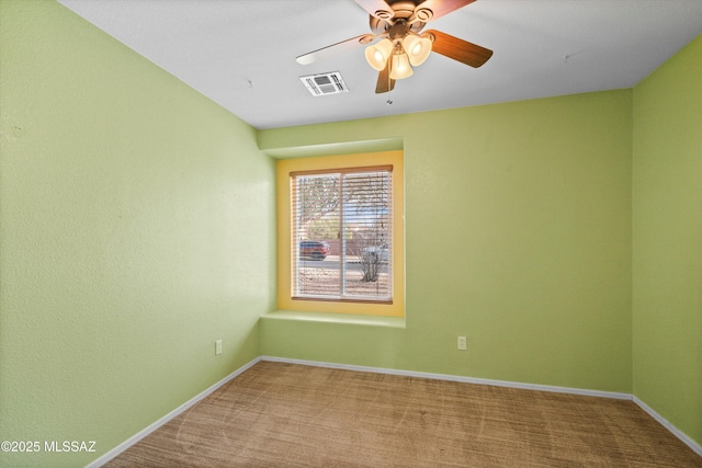 carpeted empty room with ceiling fan