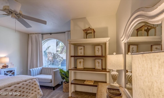 sitting room featuring ceiling fan and carpet