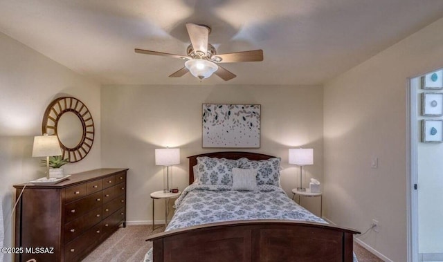 bedroom with light carpet and ceiling fan