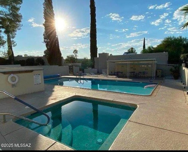 view of swimming pool featuring a patio