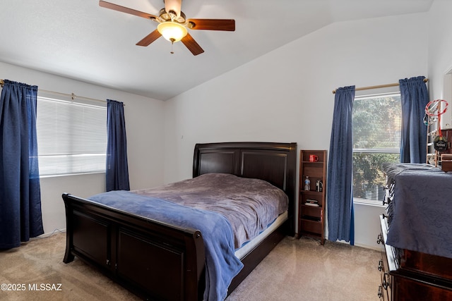 carpeted bedroom featuring vaulted ceiling and ceiling fan