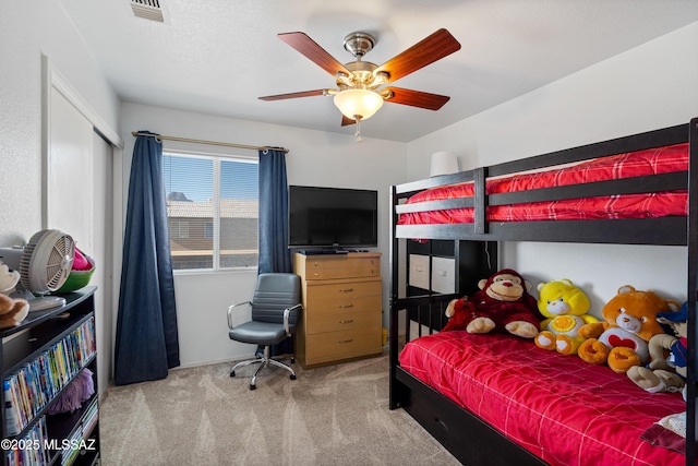 carpeted bedroom with ceiling fan