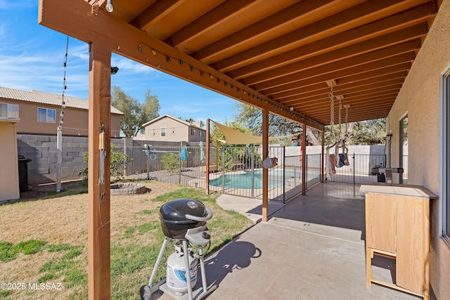 view of patio featuring a grill and a fenced in pool