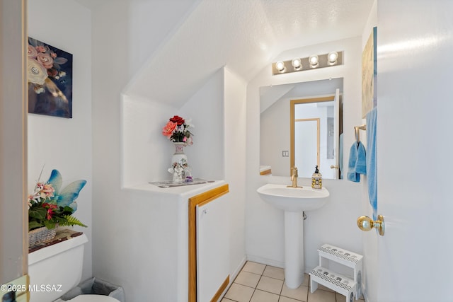 bathroom with tile patterned floors and toilet