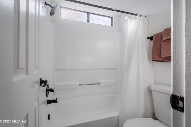 bathroom with toilet and shower / tub combo