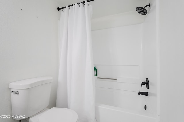 bathroom with shower / bath combo and toilet