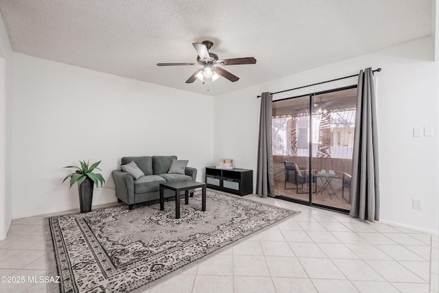 tiled living room with ceiling fan and a textured ceiling