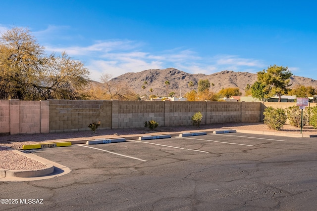 view of vehicle parking with a mountain view