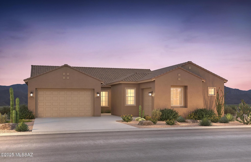 view of front of house featuring a mountain view and a garage