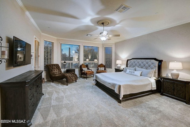 carpeted bedroom with crown molding and ceiling fan