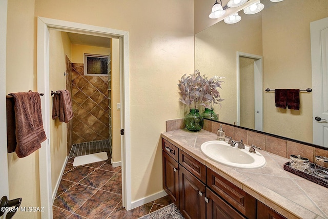 bathroom featuring vanity and a tile shower