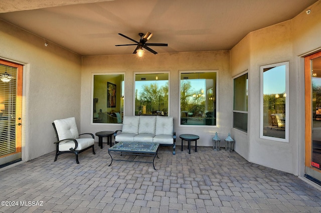 view of patio featuring outdoor lounge area and ceiling fan