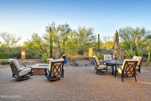 view of patio featuring an outdoor fire pit