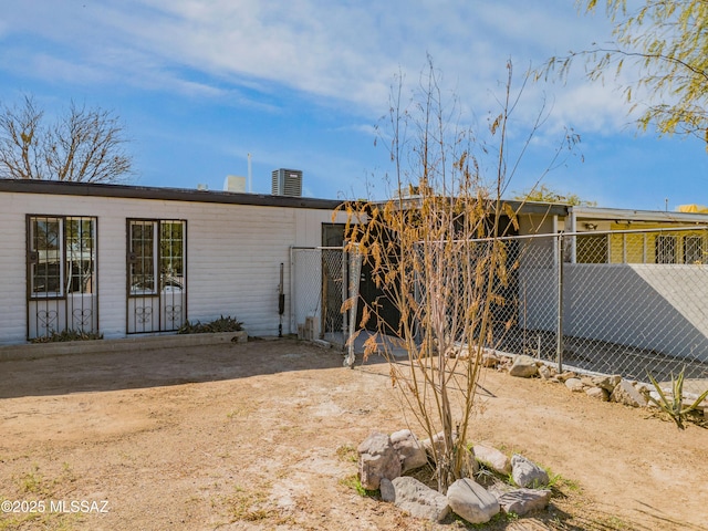 back of property with central AC unit