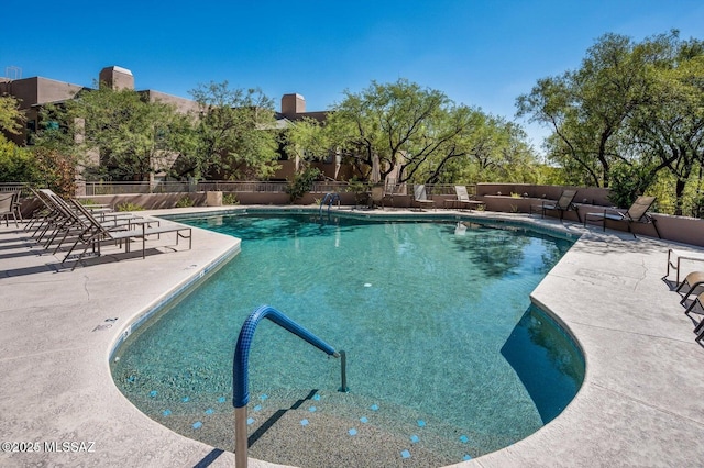 view of swimming pool with a patio area