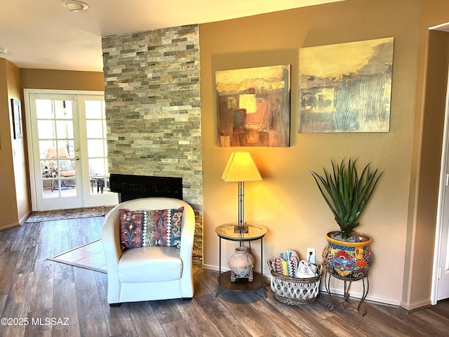 sitting room featuring dark wood-type flooring and french doors