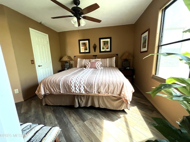 bedroom with ceiling fan and hardwood / wood-style floors