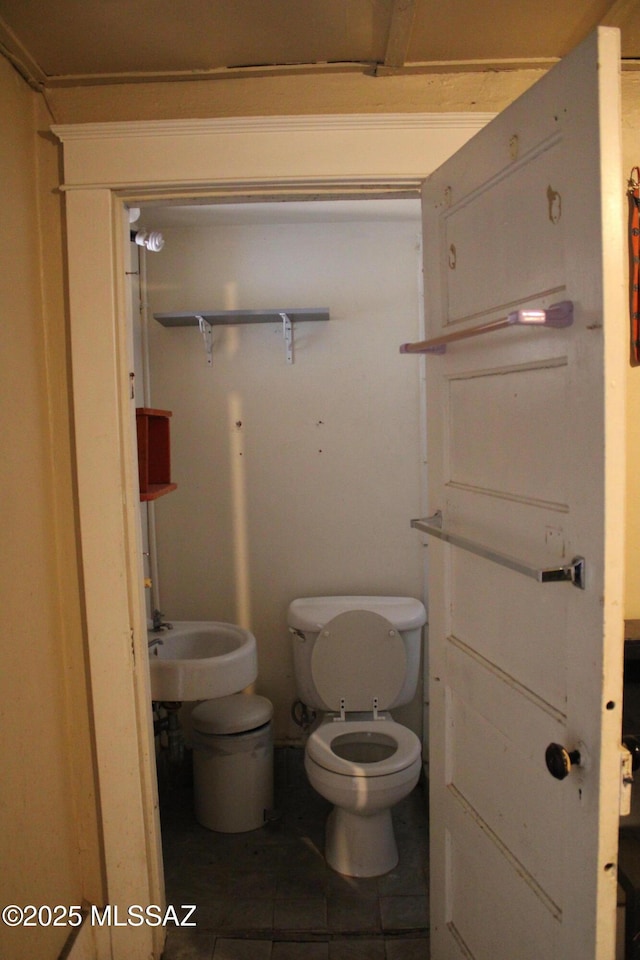 bathroom featuring tile patterned floors and toilet