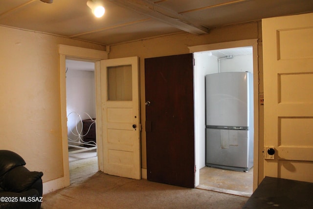 interior space featuring stainless steel refrigerator