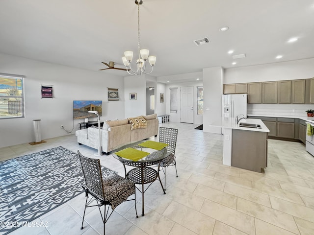 dining room featuring a chandelier, visible vents, and recessed lighting