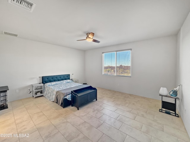 bedroom featuring a ceiling fan, visible vents, and tile patterned flooring