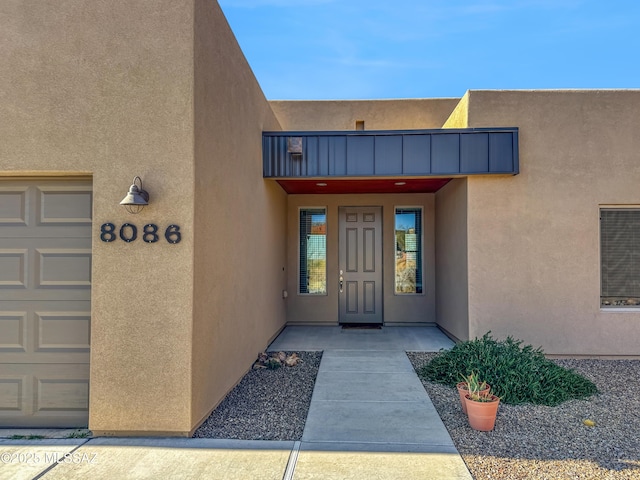 property entrance with a garage