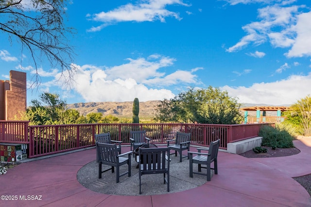 view of patio / terrace featuring an outdoor fire pit