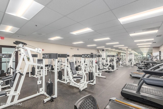 workout area featuring a paneled ceiling