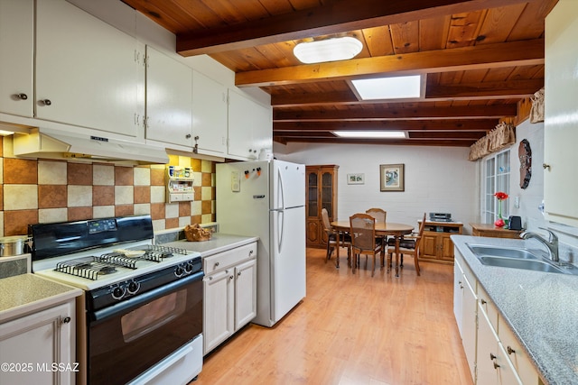 kitchen with sink, white appliances, white cabinetry, tasteful backsplash, and light wood-type flooring