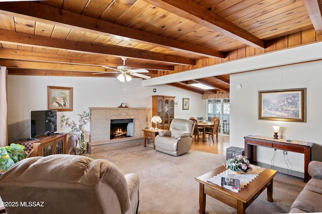 living room featuring ceiling fan, vaulted ceiling with beams, wood ceiling, and a fireplace