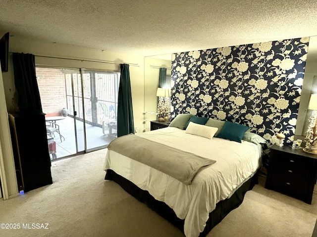 bedroom featuring wallpapered walls, access to outside, carpet, and a textured ceiling