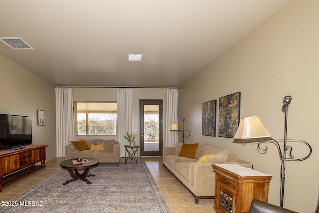 living room with light tile patterned flooring