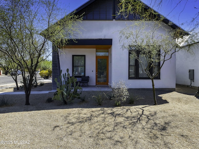 802 S 5th Ave, Tucson, AZ 85701 - view of front of house featuring stucco siding and covered porch
