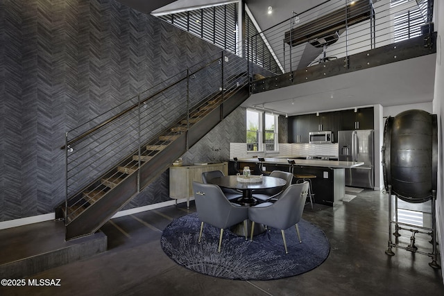 802 S 5th Ave, Tucson, AZ 85701 - dining area with finished concrete flooring and a high ceiling
