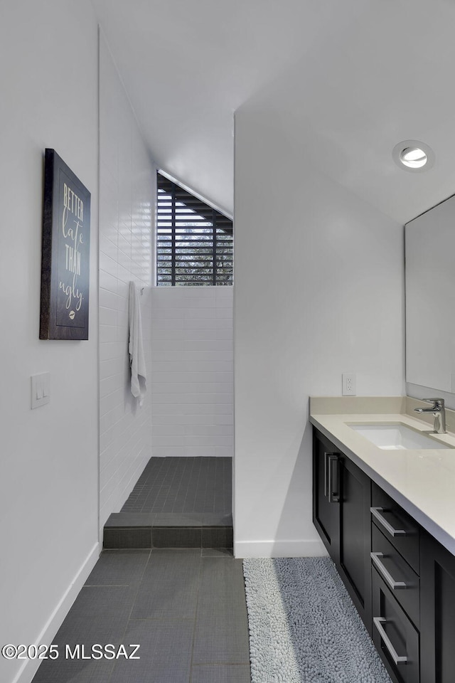 802 S 5th Ave, Tucson, AZ 85701 - full bathroom with tile patterned floors, vanity, baseboards, and tiled shower
