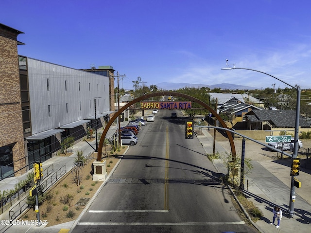 802 S 5th Ave, Tucson, AZ 85701 - view of street featuring sidewalks, street lighting, a mountain view, and curbs