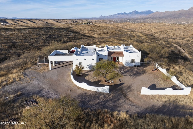 birds eye view of property with a mountain view