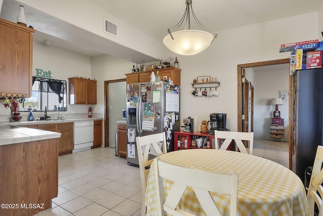 tiled dining area with sink