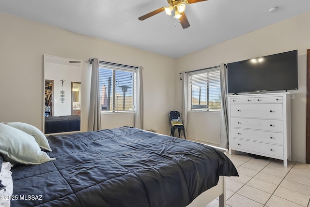 tiled bedroom with ceiling fan