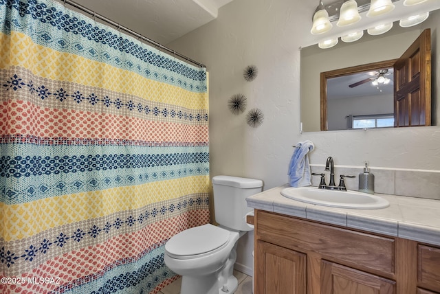 bathroom with ceiling fan, tile patterned floors, vanity, and toilet