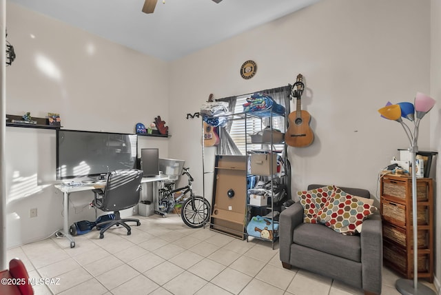 office space with light tile patterned floors and ceiling fan