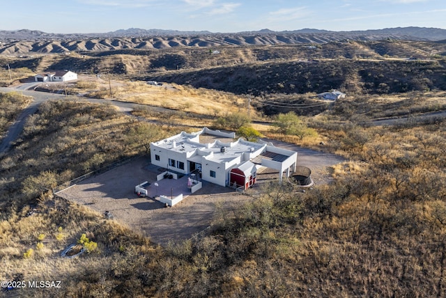 birds eye view of property featuring a mountain view