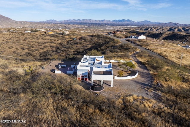 birds eye view of property featuring a mountain view