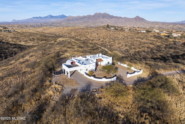 birds eye view of property featuring a mountain view